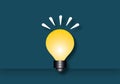 Yellow light bulb on dark wall background, Ideas inspiration concepts of business finance or goal to success. Royalty Free Stock Photo