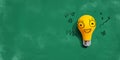 Yellow light bulb with happy face Royalty Free Stock Photo