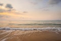 Yellow light sky and white waves on the beach in the morning, Thailand Royalty Free Stock Photo