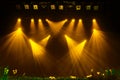 The yellow light from the spotlights through the smoke at the theater during the performance. Royalty Free Stock Photo