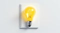 Yellow lightbulb isolated on white with notebook Royalty Free Stock Photo