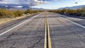 Yellow line continues a road marking on the pavement of an endless highway on US Route 66, this stretch of highway. Royalty Free Stock Photo