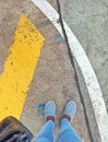 Yellow line, grey shoes...