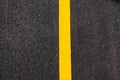 Yellow line on new asphalt detail Royalty Free Stock Photo