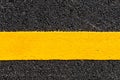 Yellow line on new asphalt detail Royalty Free Stock Photo