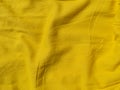 Yellow linen cloth texture pattern for abstract design Wavy natural textile backdrop Sunny color fabric blank background