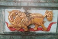 Yellow lion carving on the wall