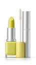 Yellow lipstick and lip gloss set with silver case on white background Royalty Free Stock Photo