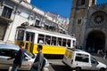 Yellow Lisbon street car by cathedral Royalty Free Stock Photo