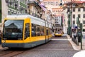 Yellow lisbon tram on the old street Royalty Free Stock Photo