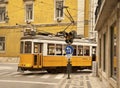 Yellow Lisbon tram in street in Portugal Royalty Free Stock Photo