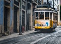 Yellow Lisbon tram uphill, Chiado, Portugal