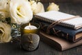 Yellow lisianthus flowers and lit candle