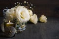 Yellow lisianthus flowers and lit candle