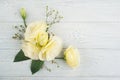 Yellow lisianthus flowers and lit candle