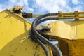 Yellow loaders connecting pipes Royalty Free Stock Photo