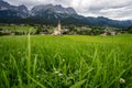 Yellow local church in Ellmau. Village of Going. Wilden Kaiser mountains in background. Tirol, Alps, Austria