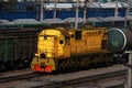 Yellow locomotive at a freight station Royalty Free Stock Photo