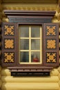 Yellow Log Cabin Wall With One Ornamental Window Royalty Free Stock Photo