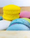 Yellow Macaron stacked on wooden