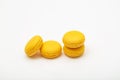 Yellow macaroons on white background