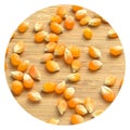 Yellow maize corn kernels ready for making popcorn, on bamboo cutting board Royalty Free Stock Photo