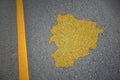 yellow map of andorra country on asphalt road near yellow line