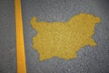 yellow map of bulgaria country on asphalt road near yellow line