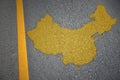 yellow map of china country on asphalt road near yellow line