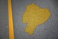 yellow map of ecuador country on asphalt road near yellow line.