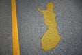 yellow map of finland country on asphalt road near yellow line Royalty Free Stock Photo