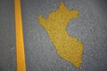 yellow map of peru country on asphalt road near yellow line.