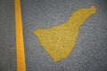 yellow map of tenerife on asphalt road near yellow line