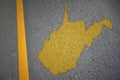 yellow map of west virginia state on asphalt road near yellow line Royalty Free Stock Photo