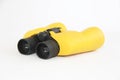 Yellow marine optical plastic binoculars on a white background