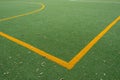 Yellow marking on artificial grass soccer.