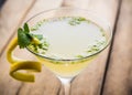 Yellow martini cocktail with lemon and mint Royalty Free Stock Photo