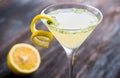 Yellow martini cocktail with lemon and mint