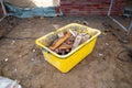 Yellow mason shed filled with waste stands on a construction site Royalty Free Stock Photo