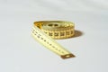 Yellow measure tape isolated in white Royalty Free Stock Photo