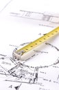 Yellow measuring tape on a builders plan Royalty Free Stock Photo