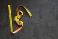 Yellow Measuring tape for tool roulette or ruler. Tape measure template in centimeters. Tapes meter set isolated on black backgrou Royalty Free Stock Photo