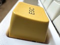 Yellow mechanical exit button on white mechanical keyboard for programmers and for remote work side view Royalty Free Stock Photo