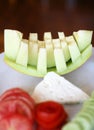 Yellow melon, cucumbers, tomatoes and white cheese Royalty Free Stock Photo