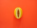 Yellow Melon Fruit isolated in orange background viewed from above - flatlay look - Image