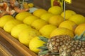 Yellow melon. Many melons to be sold and pineapple in the background