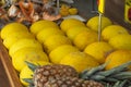 Yellow melon. Many melons to be sold and pineapple in the background