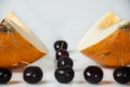 Compisition on white background with fruit. Melon and cherrys