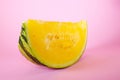 Yellow melon watermelon slice on pink background. Royalty Free Stock Photo