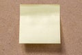 yellow memory note sticked to brown memory board Royalty Free Stock Photo